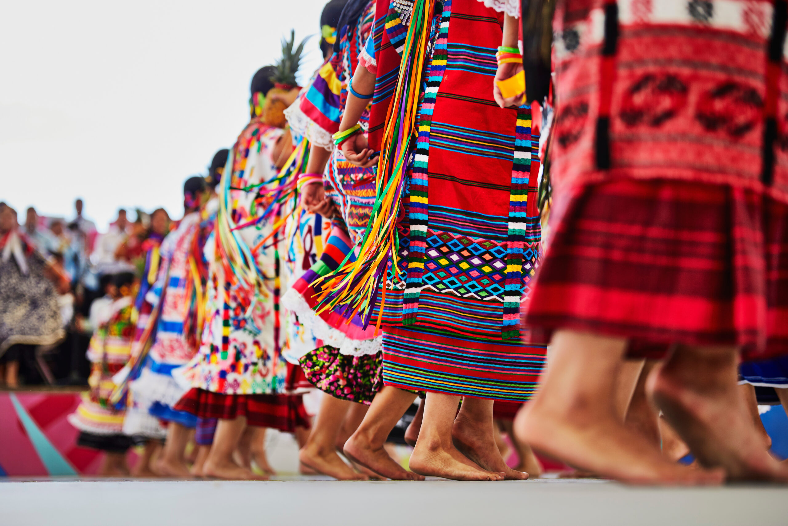 Feet of people wearing traditional Oaxaca dresses
